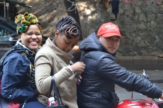 Driving through the city on a motorbike.